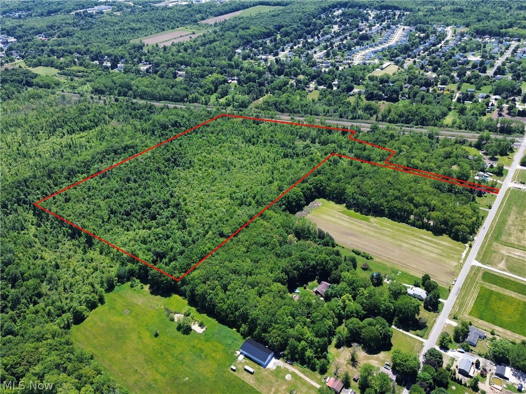 0 Dayton Road Madison, OH 44057 - Photo 2 of 14 Expansive wooded acreage outlined in red, featuring significant tree coverage and open land portions