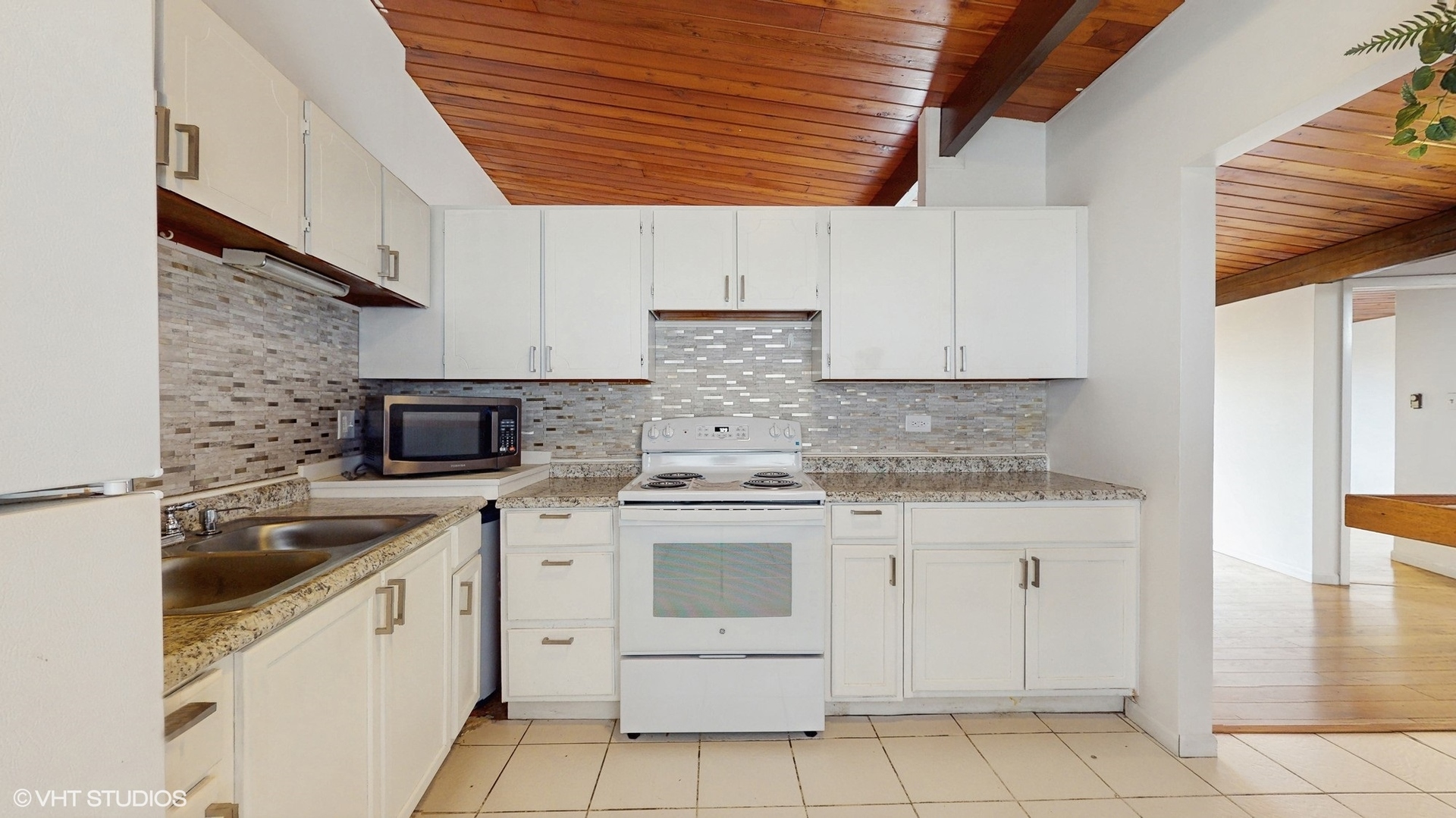 2306 Holiday Terrace, Unit 166 Lansing, IL 60438 - Photo 6 of 13 a kitchen with a stove sink and cabinets