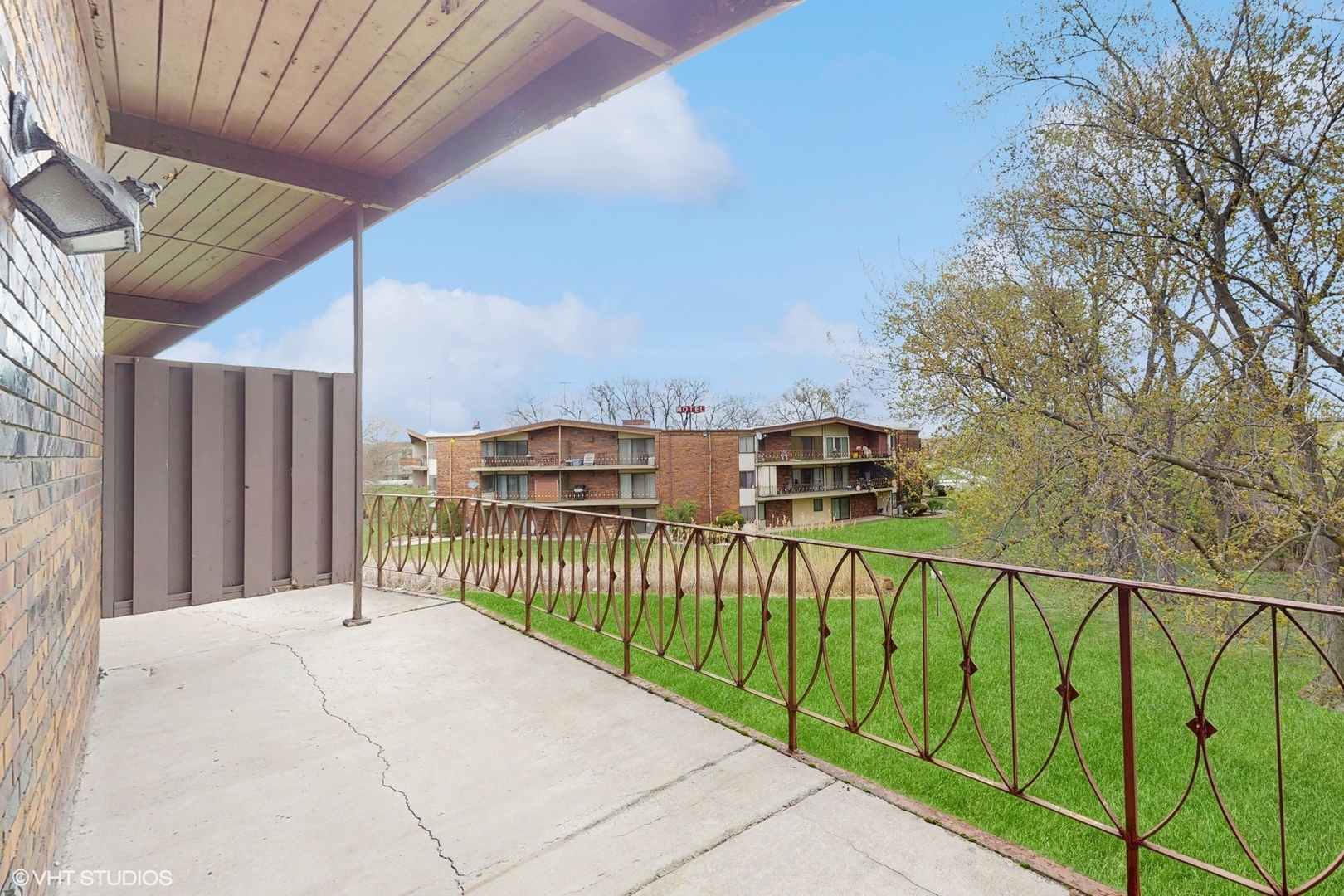 2306 Holiday Terrace, Unit 166 Lansing, IL 60438 - Photo 10 of 13 a view of a balcony with a park
