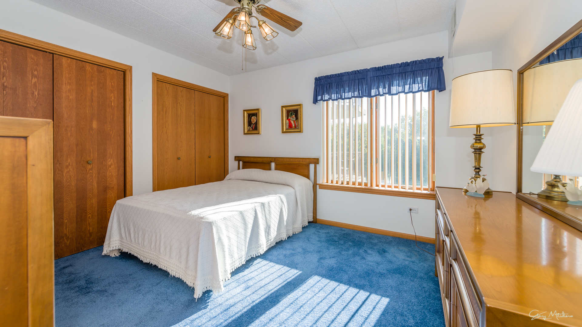 3680 186th Street, Unit 303 Lansing, IL 60438 - Photo 11 of 23 a bedroom with a bed and wooden floor