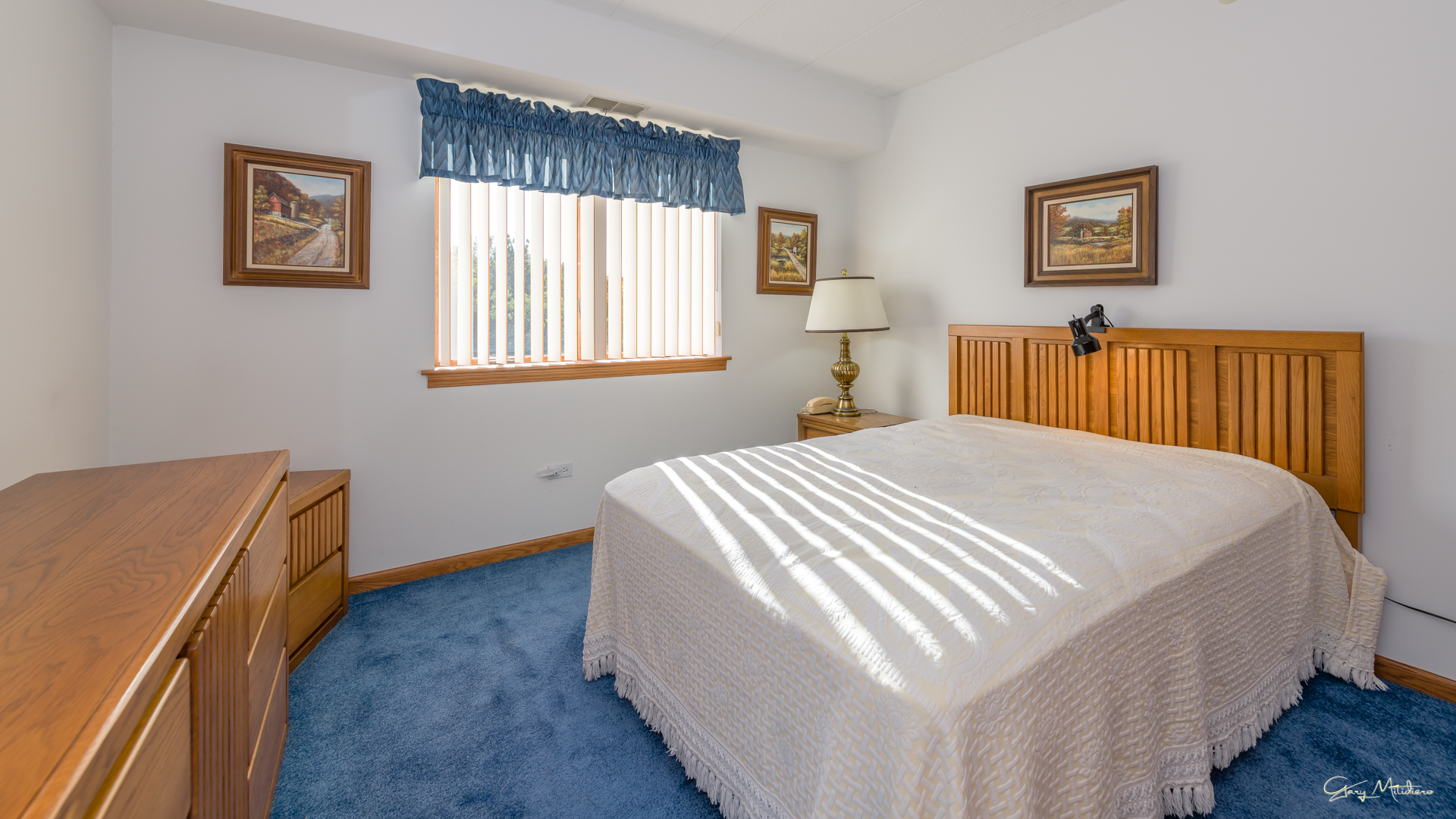 3680 186th Street, Unit 303 Lansing, IL 60438 - Photo 12 of 23 a bed sitting in a bedroom next to a window