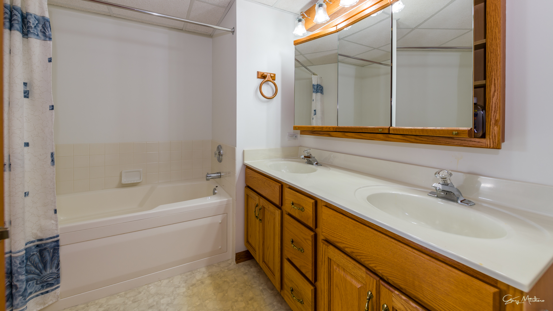 3680 186th Street, Unit 303 Lansing, IL 60438 - Photo 14 of 23 a bathroom with a tub sink and mirror