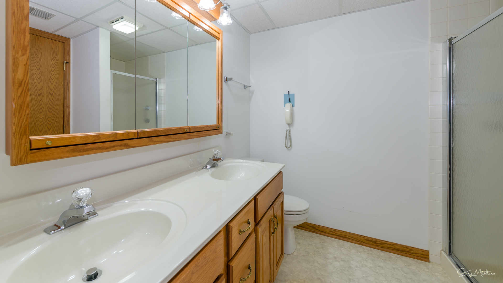 3680 186th Street, Unit 303 Lansing, IL 60438 - Photo 15 of 23 a bathroom with a sink and a mirror
