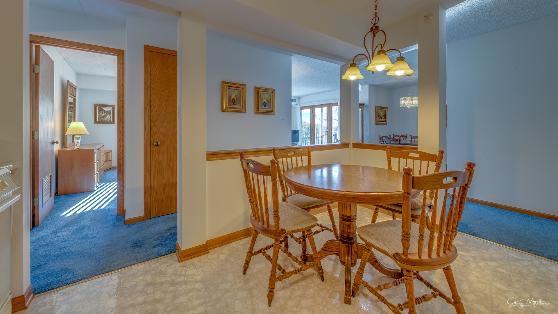 3680 186th Street, Unit 303 Lansing, IL 60438 - Photo 9 of 23 a view of a dining room with furniture and wooden floor