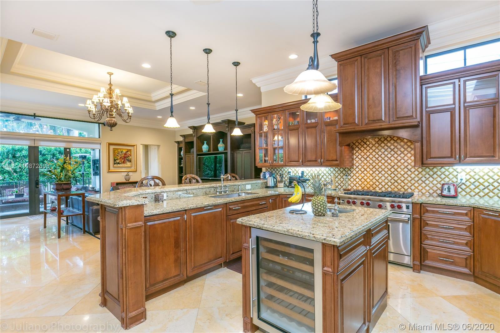 19141 North Bay Road Sunny Isles Beach, FL 33160 - Photo 14 of 42 a kitchen that has a lot of cabinets in it