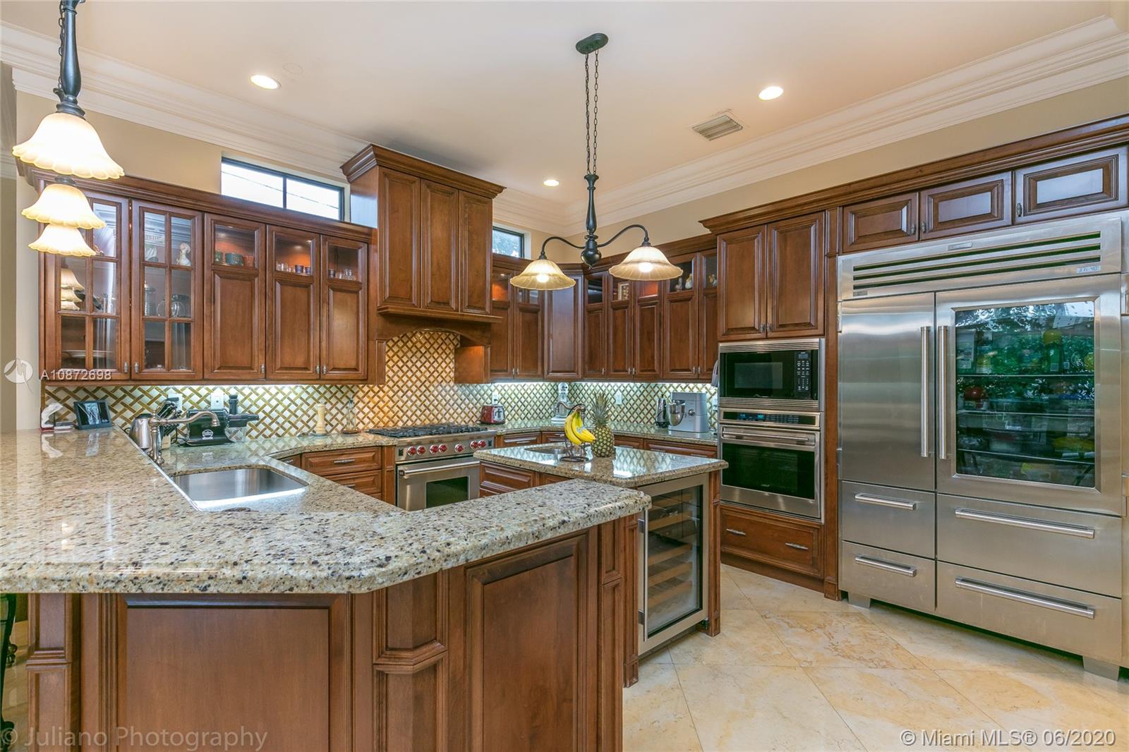 19141 North Bay Road Sunny Isles Beach, FL 33160 - Photo 15 of 42 a kitchen with granite countertop a stove a sink and a refrigerator