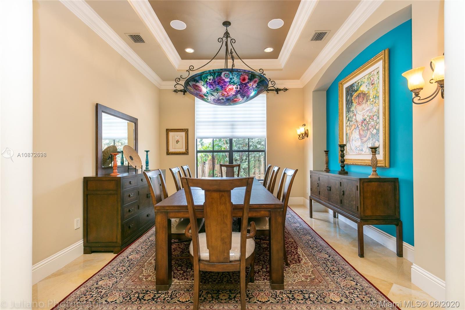 19141 North Bay Road Sunny Isles Beach, FL 33160 - Photo 18 of 42 a view of a dining room with furniture wooden floor and a chandelier