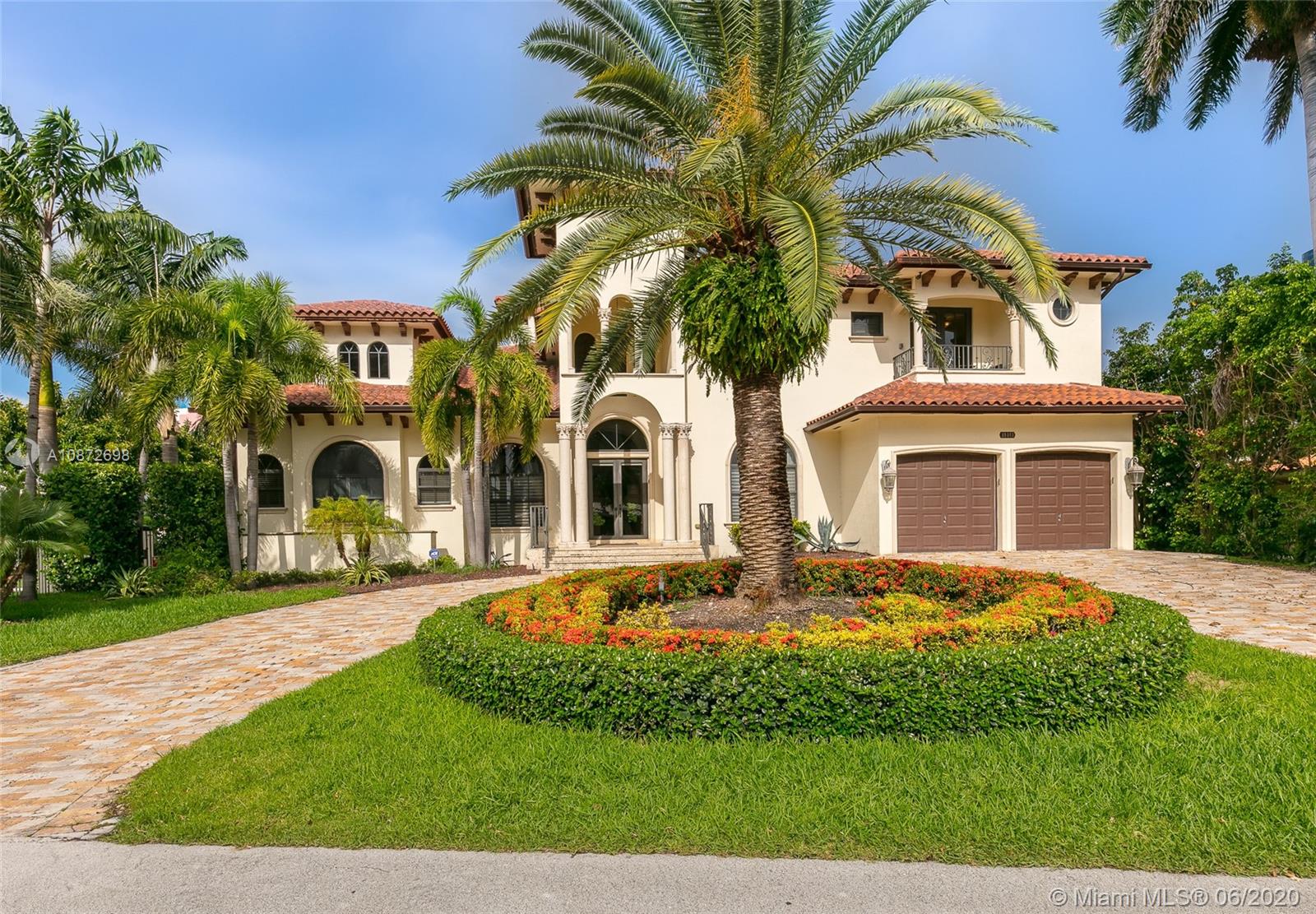 19141 North Bay Road Sunny Isles Beach, FL 33160 - Photo 2 of 42 front view of a house with a yard