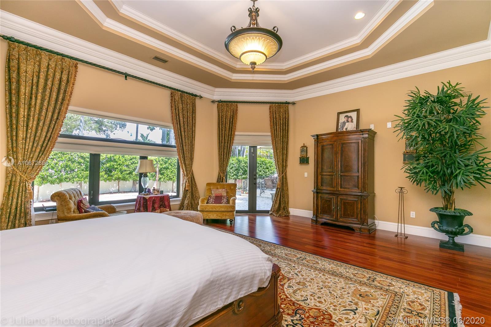 19141 North Bay Road Sunny Isles Beach, FL 33160 - Photo 21 of 42 a bedroom with a bed and large windows