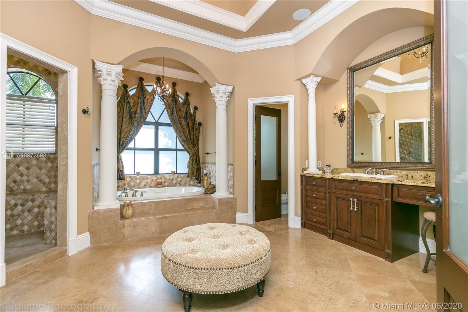 19141 North Bay Road Sunny Isles Beach, FL 33160 - Photo 23 of 42 a view of a bathroom with a tub shower sink and mirror