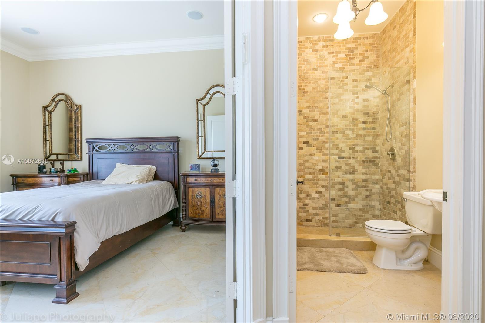 19141 North Bay Road Sunny Isles Beach, FL 33160 - Photo 33 of 42 a bedroom with a bed and a potted plant