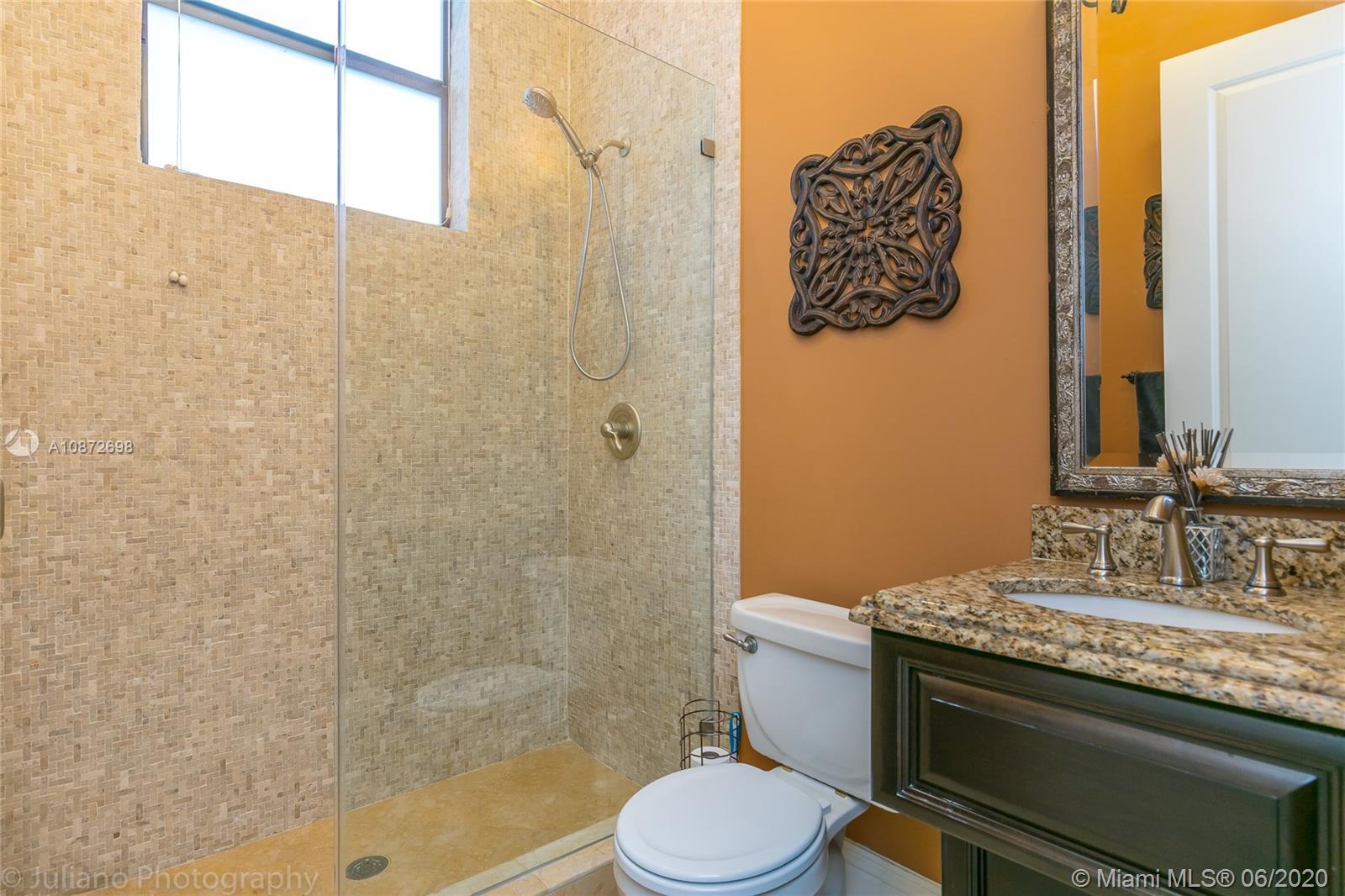 19141 North Bay Road Sunny Isles Beach, FL 33160 - Photo 35 of 42 a bathroom with a granite countertop sink toilet and shower