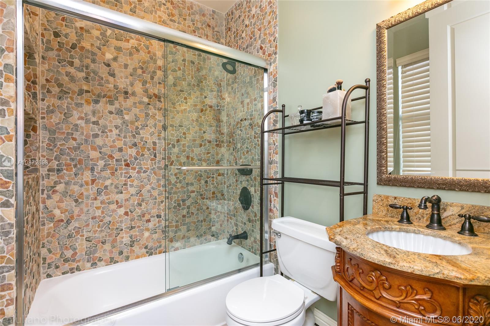 19141 North Bay Road Sunny Isles Beach, FL 33160 - Photo 36 of 42 a bathroom with a sink toilet and shower