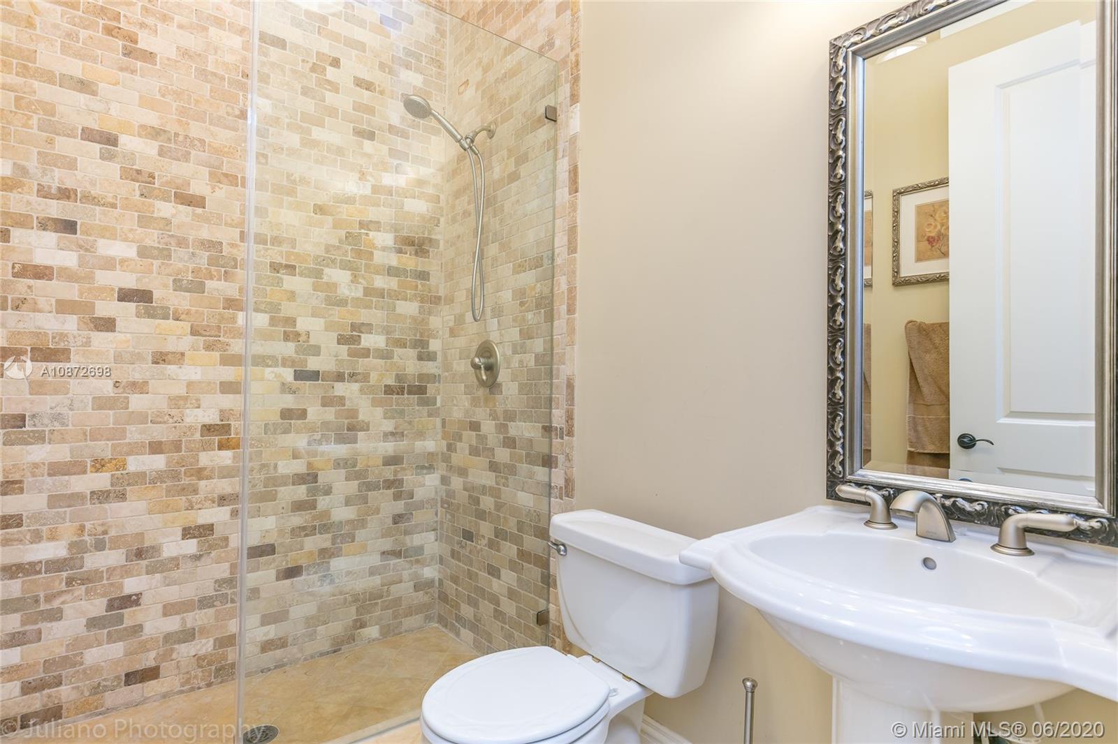 19141 North Bay Road Sunny Isles Beach, FL 33160 - Photo 37 of 42 a bathroom with a sink and a mirror