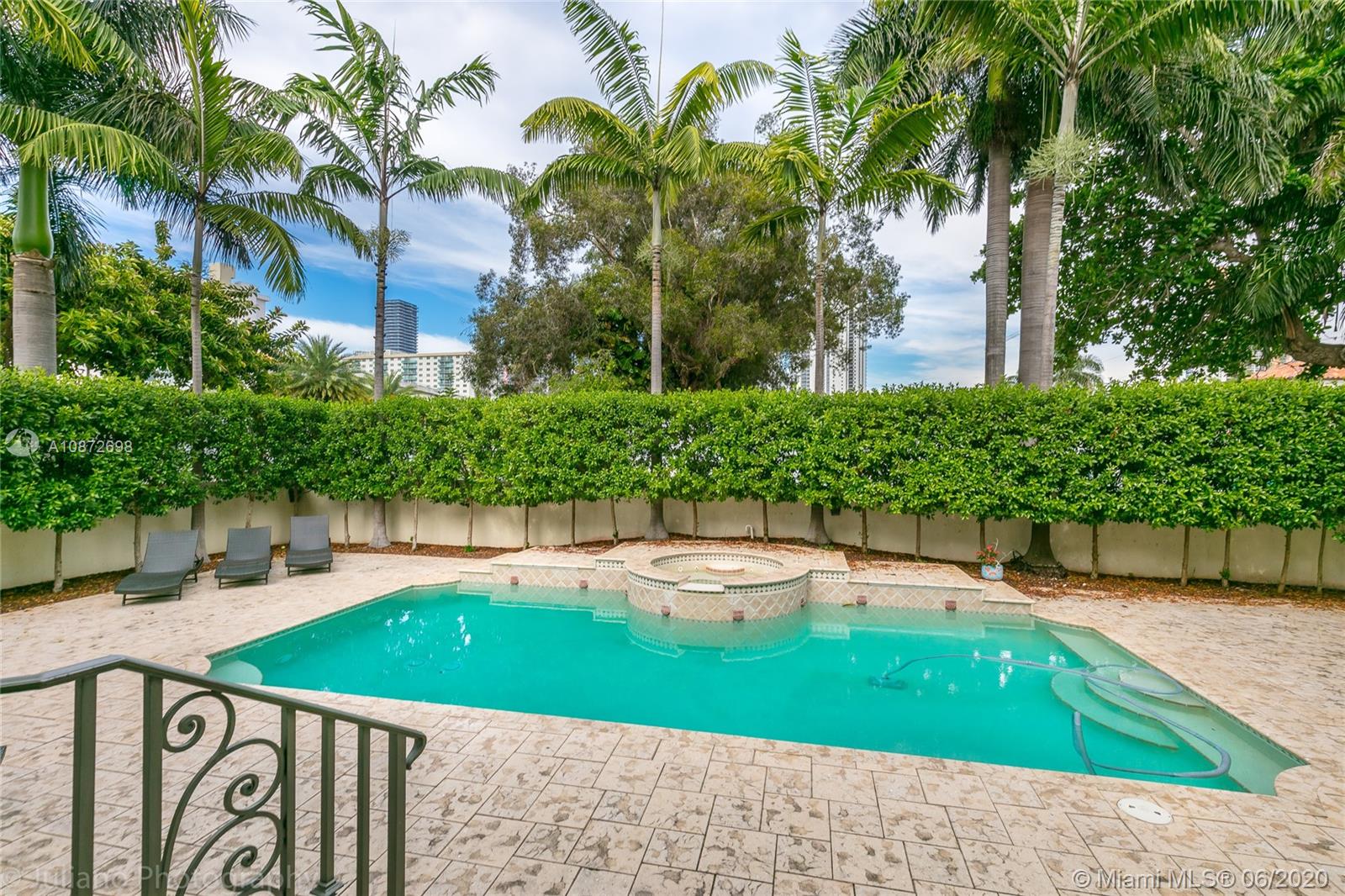 19141 North Bay Road Sunny Isles Beach, FL 33160 - Photo 5 of 42 a view of a swimming pool with a patio