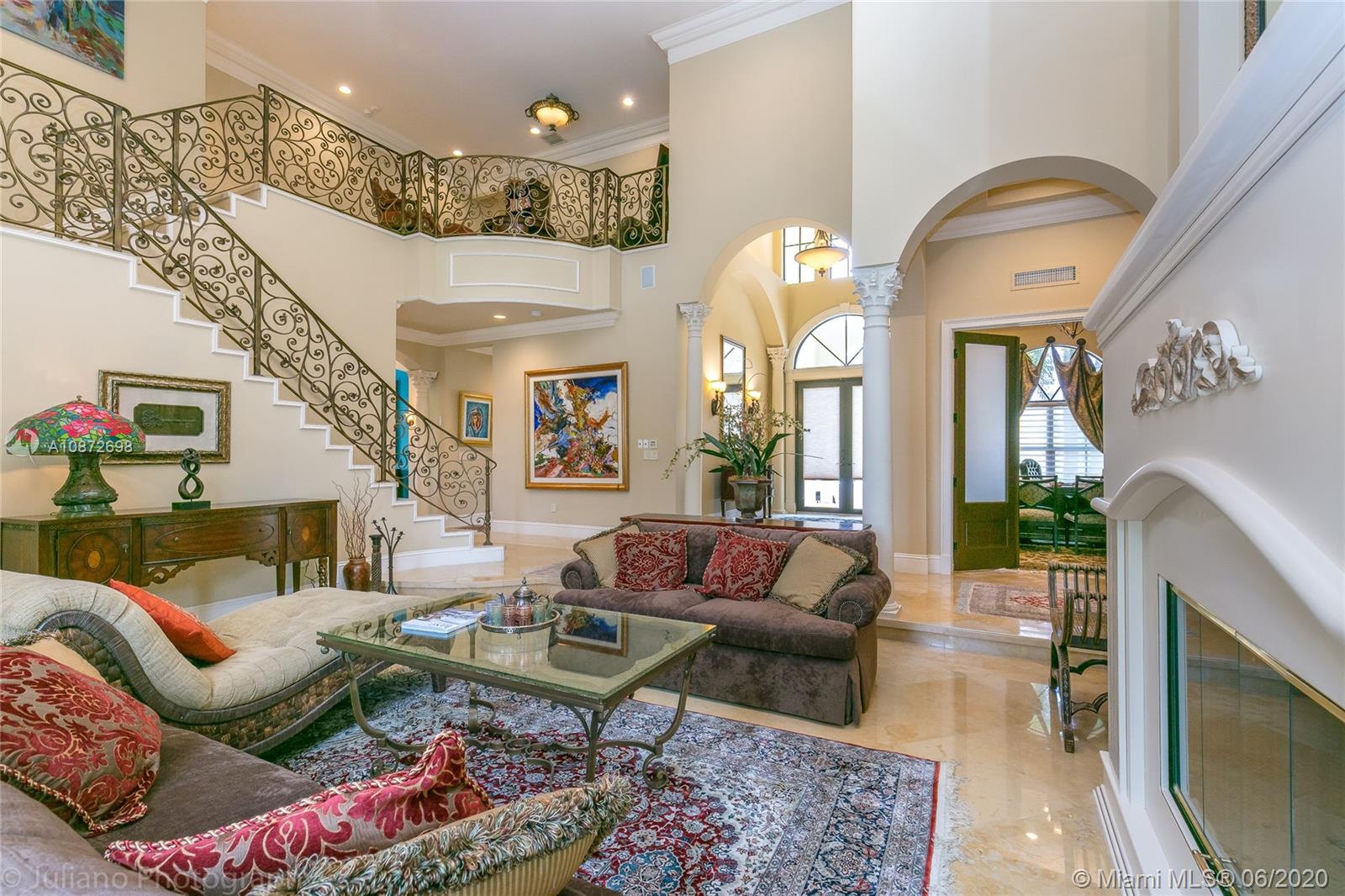 19141 North Bay Road Sunny Isles Beach, FL 33160 - Photo 8 of 42 a living room with furniture and a fireplace