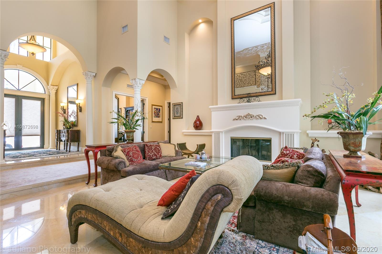 19141 North Bay Road Sunny Isles Beach, FL 33160 - Photo 9 of 42 a living room with furniture fireplace and a large window