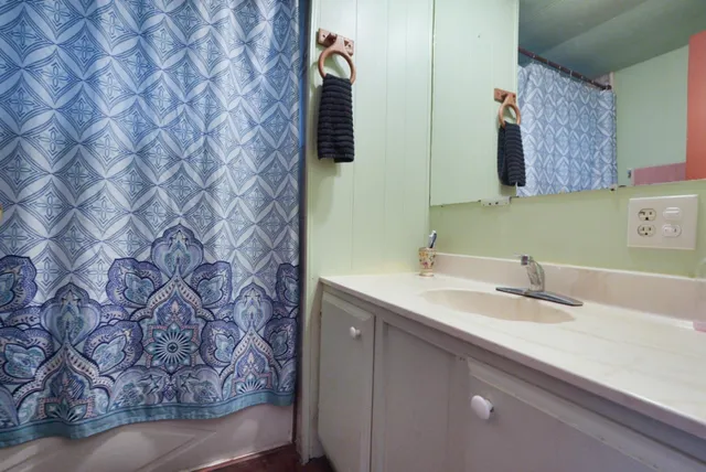 a bathroom with a sink and a mirror