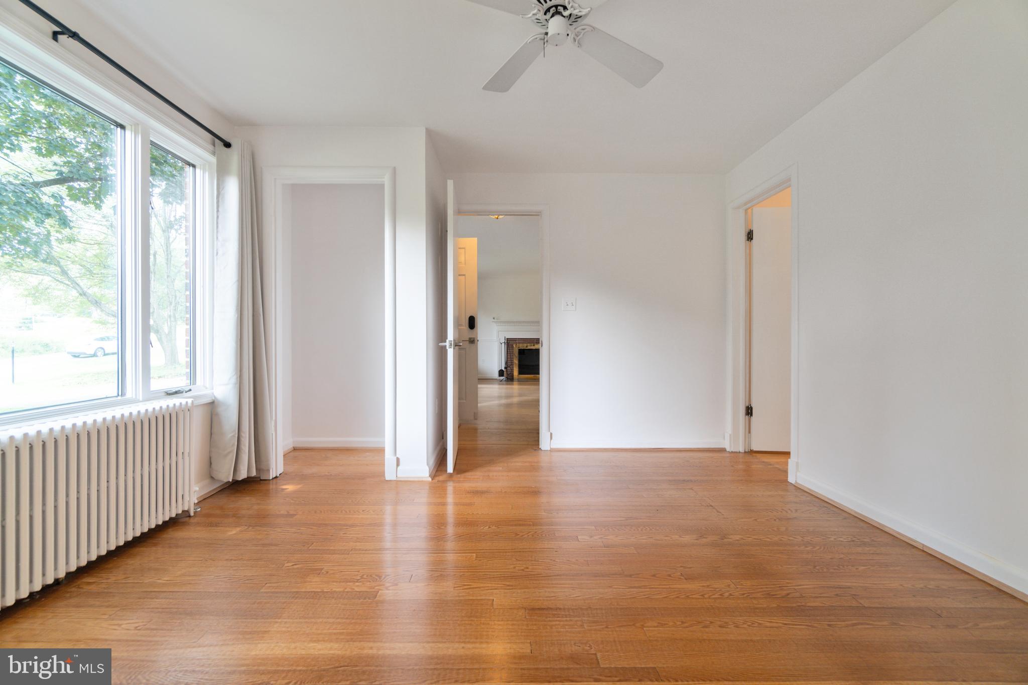 14612 Fairacres Road Silver Spring, MD 20905 - Photo 11 of 53 a view of a hallway with wooden floor and cabinet