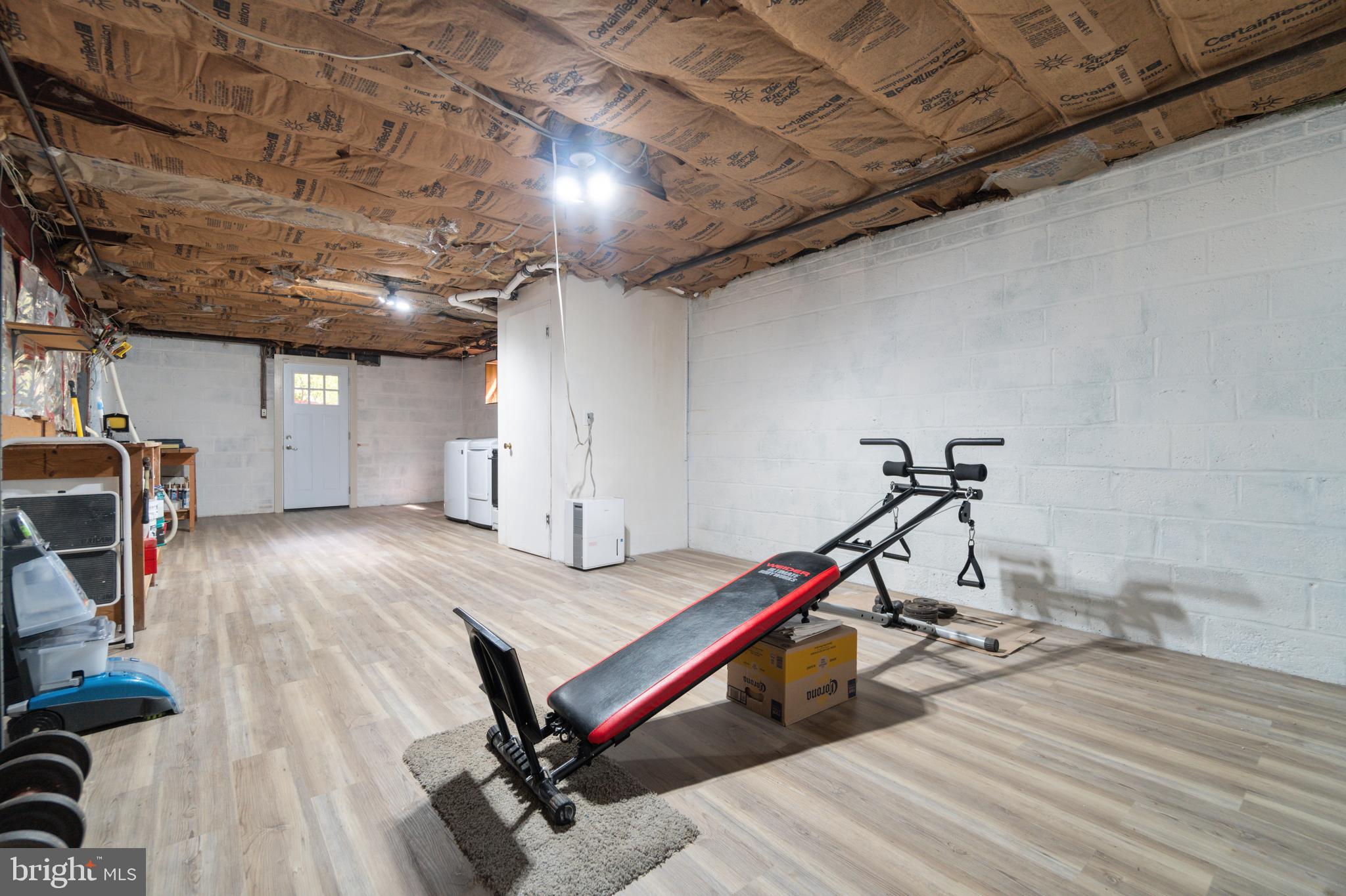 14612 Fairacres Road Silver Spring, MD 20905 - Photo 30 of 53 a room with wooden furniture and table