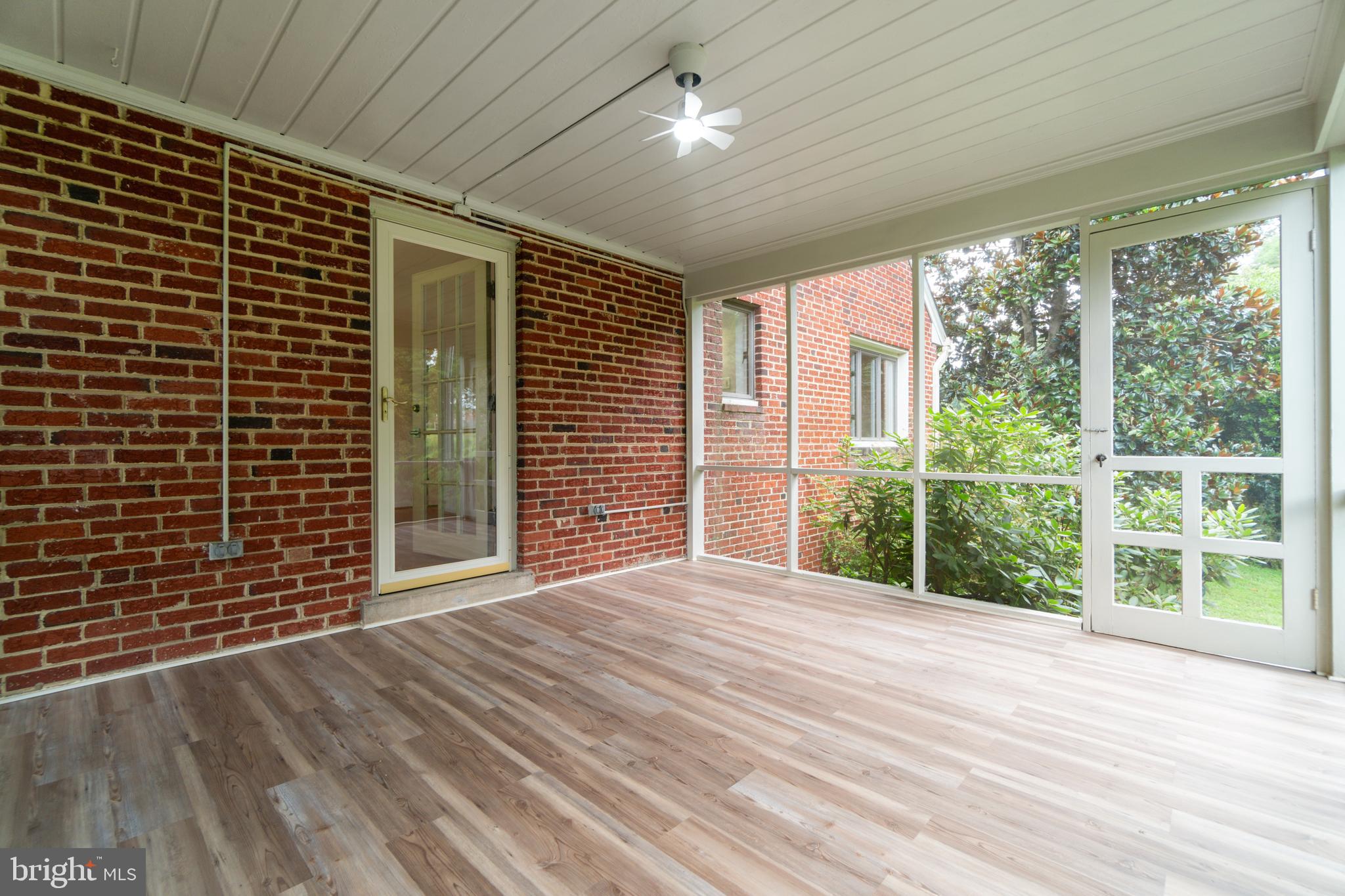 14612 Fairacres Road Silver Spring, MD 20905 - Photo 34 of 53 a view of an empty room with wooden floor and iron stairs