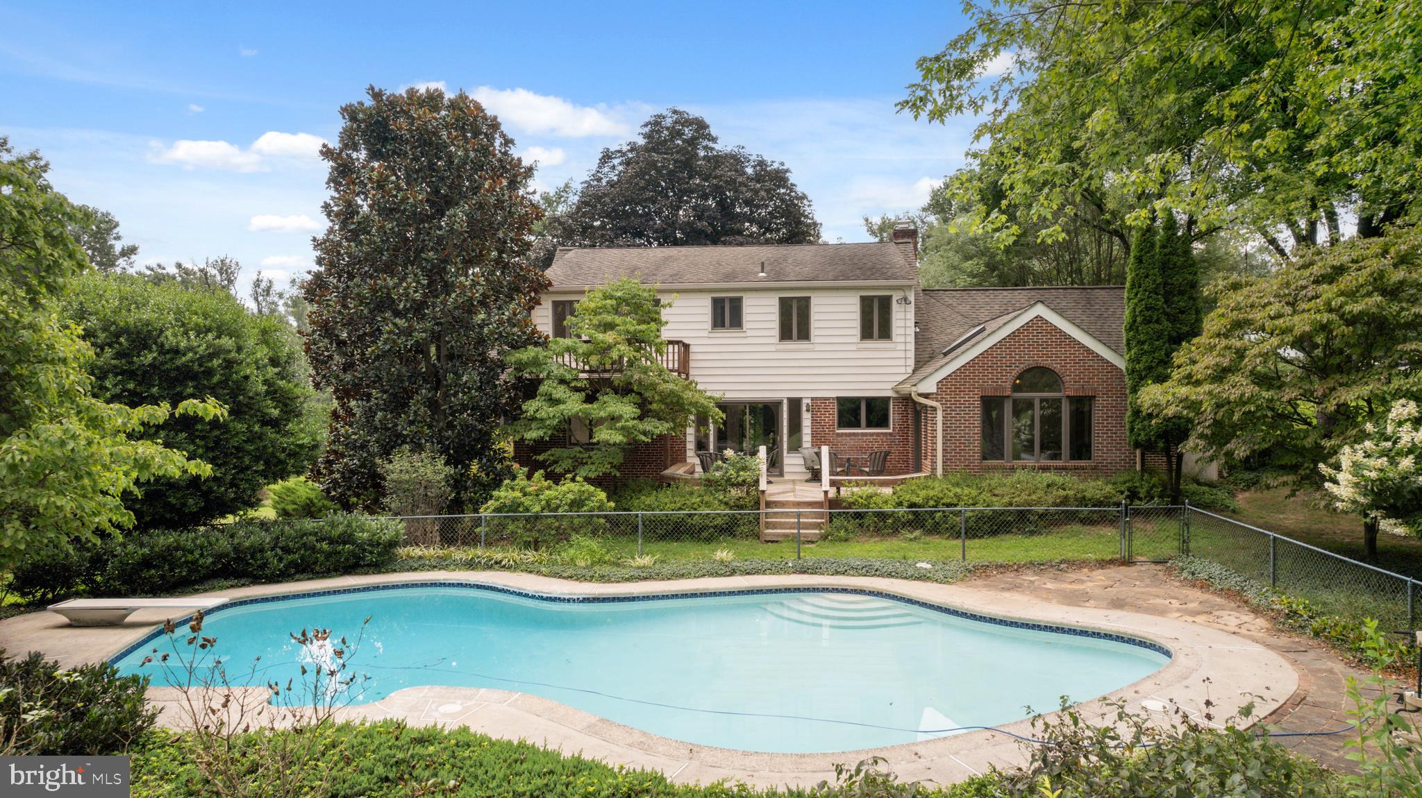 14612 Fairacres Road Silver Spring, MD 20905 - Photo 36 of 53 a view of a house with pool yard and a chairs