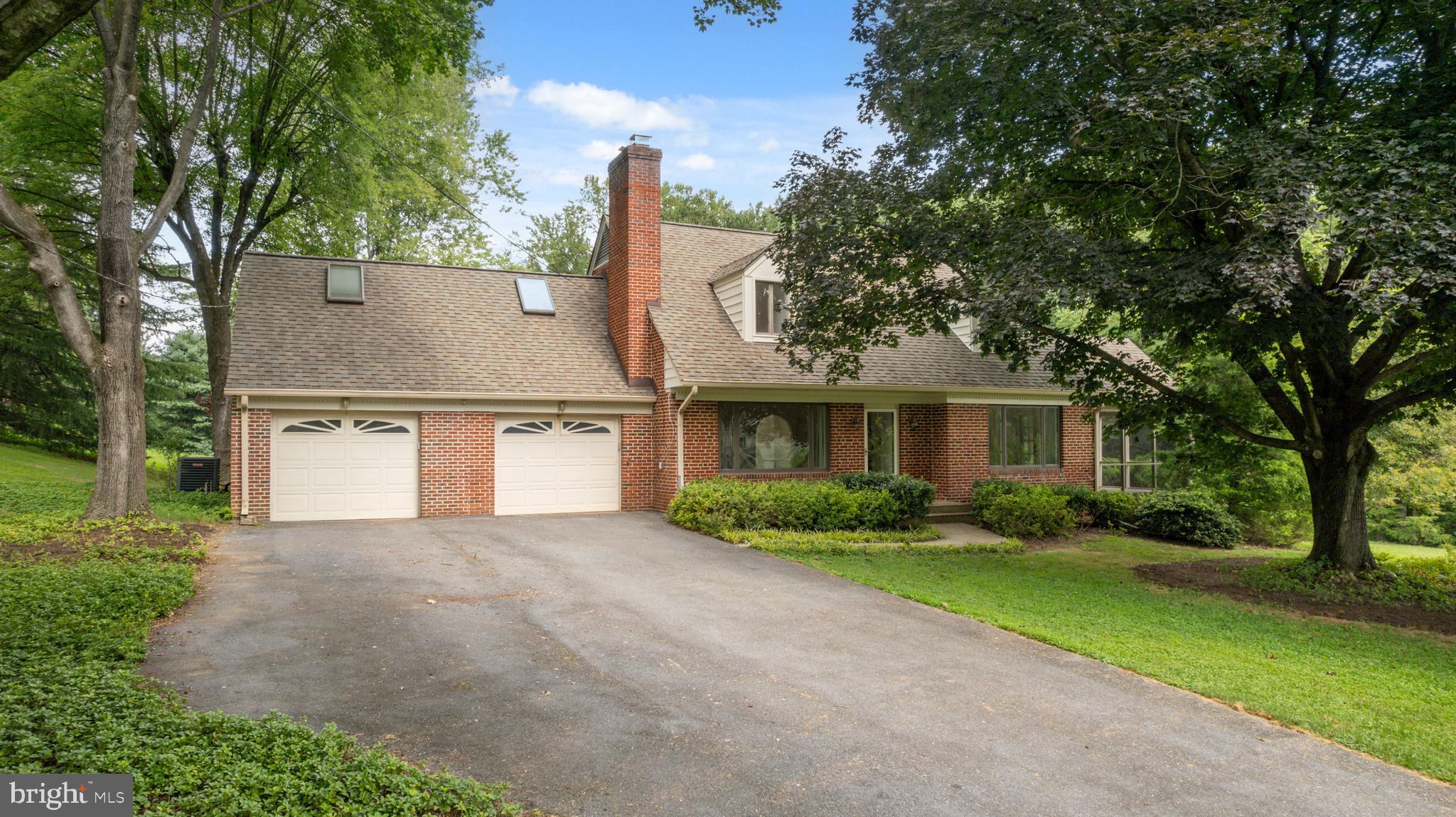 14612 Fairacres Road Silver Spring, MD 20905 - Photo 47 of 53 a front view of a house with a garden and trees