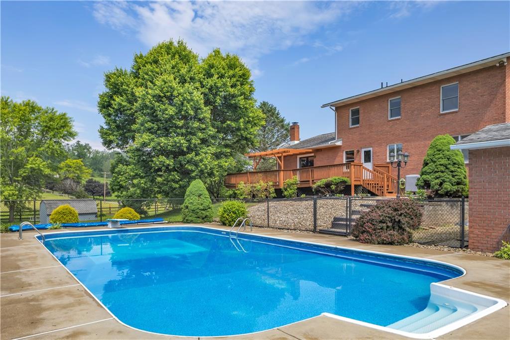 206 Brook Hollow Road Mount Pleasant, PA 15666 - Photo 13 of 41 a view of a house with a swimming pool
