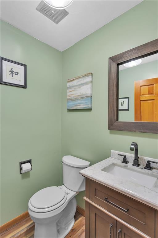 206 Brook Hollow Road Mount Pleasant, PA 15666 - Photo 30 of 41 a bathroom with a granite countertop toilet sink and mirror