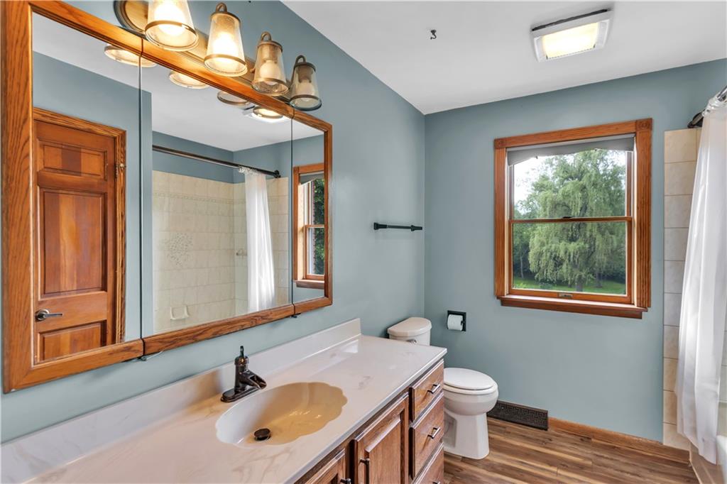 206 Brook Hollow Road Mount Pleasant, PA 15666 - Photo 31 of 41 a bathroom with a sink vanity granite toilet and a mirror