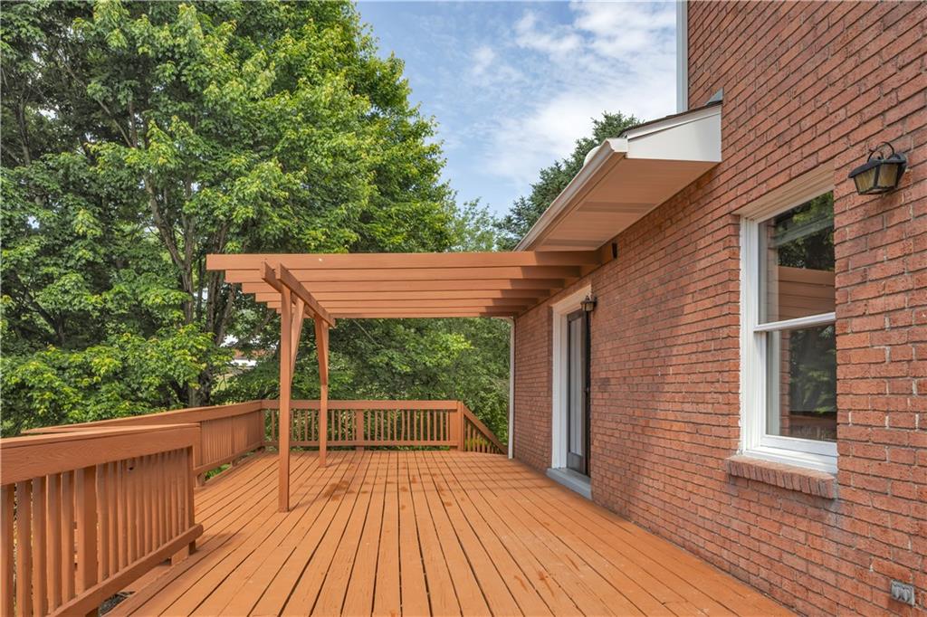 206 Brook Hollow Road Mount Pleasant, PA 15666 - Photo 10 of 41 a view of backyard with a deck and wooden floor