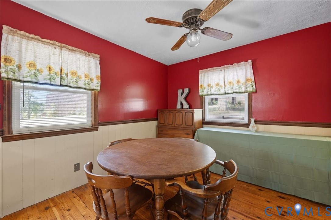237 Craddock Street Boydton, VA 23917 - Photo 17 of 41 Dining area with a wainscoted wall, wood-type floo
