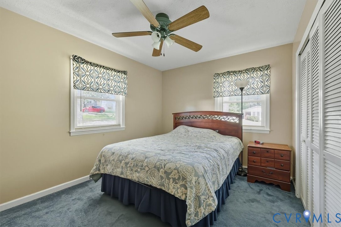 237 Craddock Street Boydton, VA 23917 - Photo 18 of 41 Bedroom featuring a closet, ceiling fan, dark carp