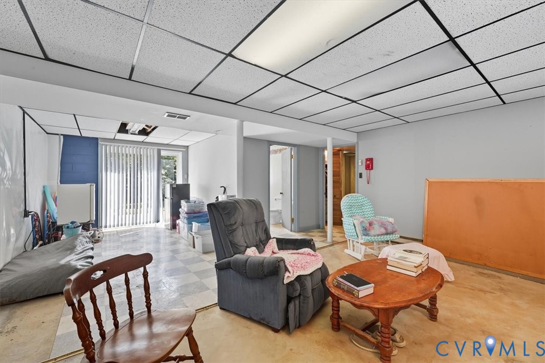 237 Craddock Street Boydton, VA 23917 - Photo 30 of 41 Living area with a paneled ceiling and tile patter