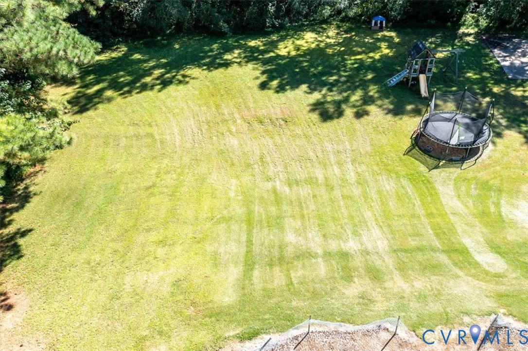 237 Craddock Street Boydton, VA 23917 - Photo 38 of 41 View of grassy yard featuring a trampoline