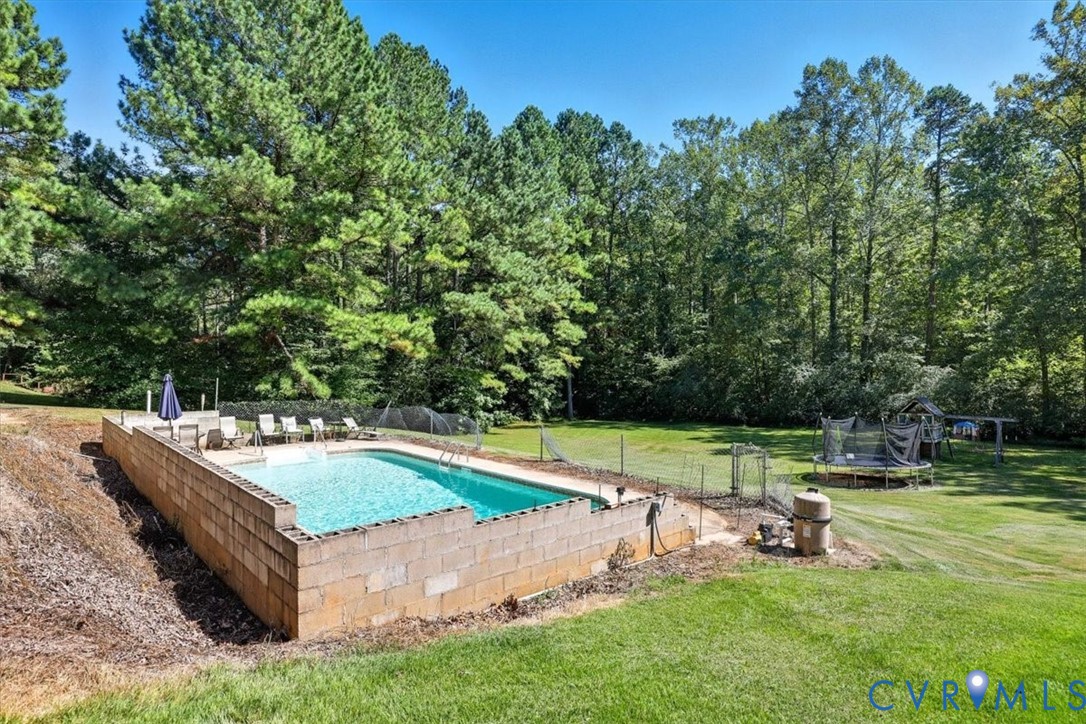 237 Craddock Street Boydton, VA 23917 - Photo 39 of 41 View of pool with a trampoline and a patio