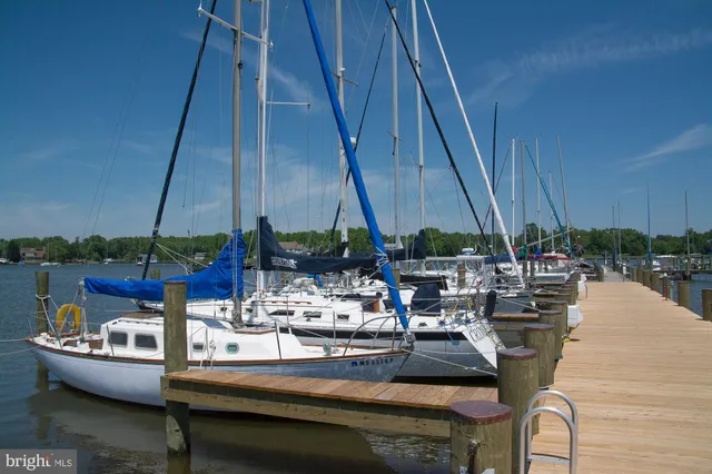 a view of roof deck with table and chairs