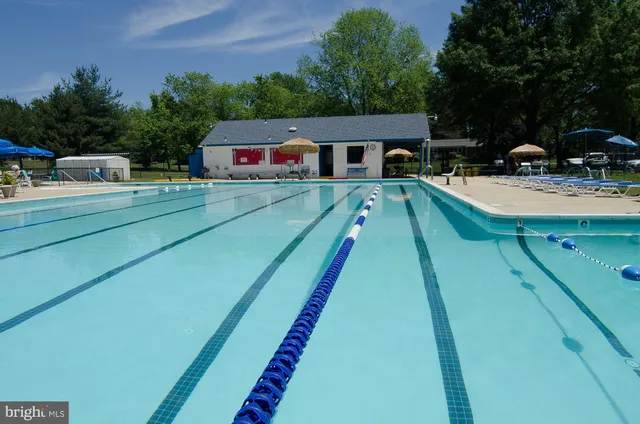 a aerial view of a house with swimming pool