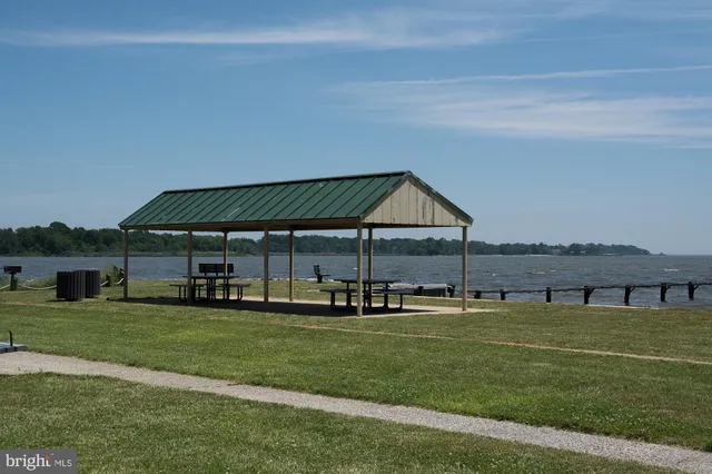 swimming pool with outdoor seating and yard