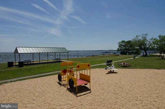 a view of a park with seating space