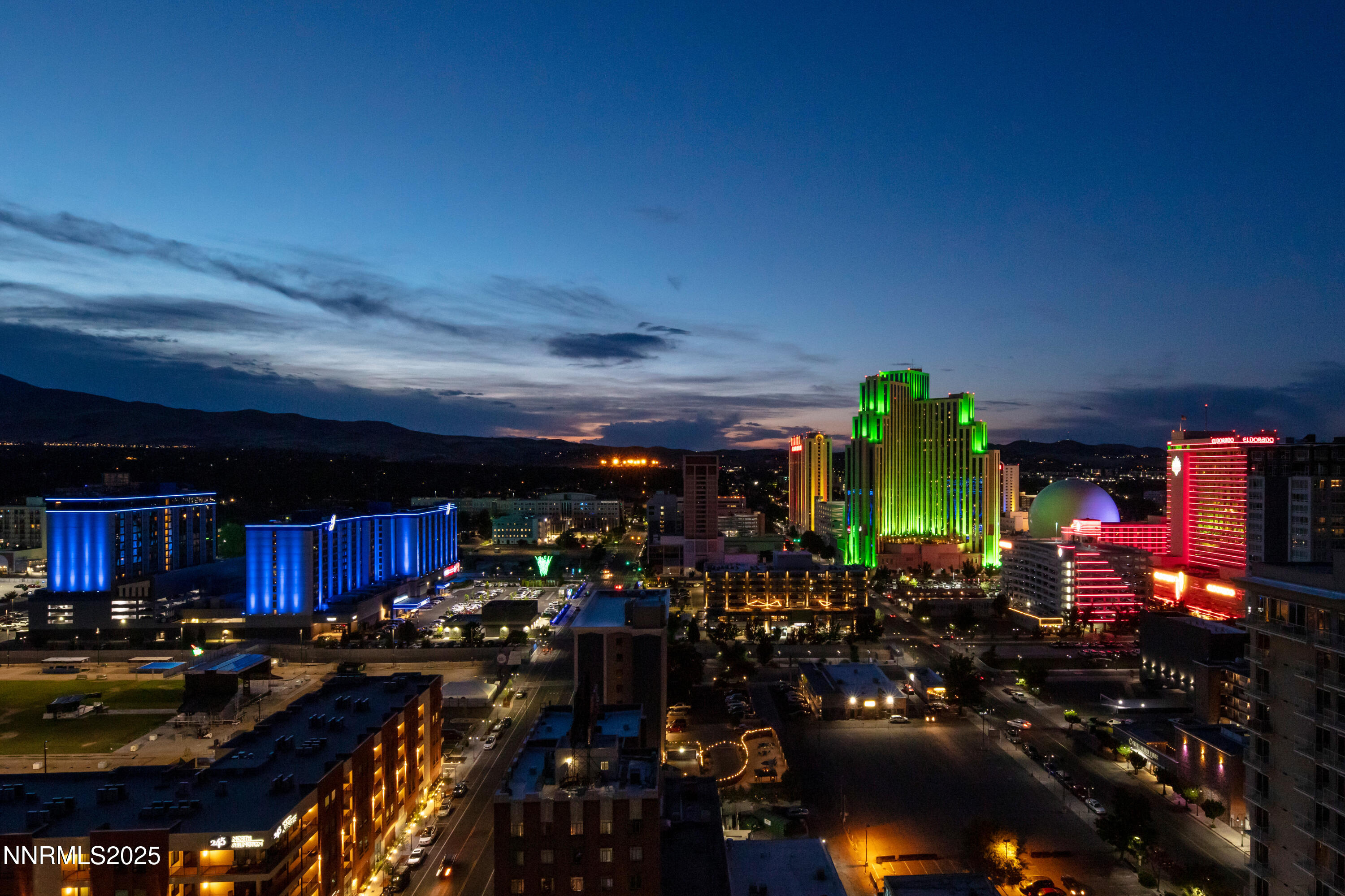 a view of a street with lots of car parked
