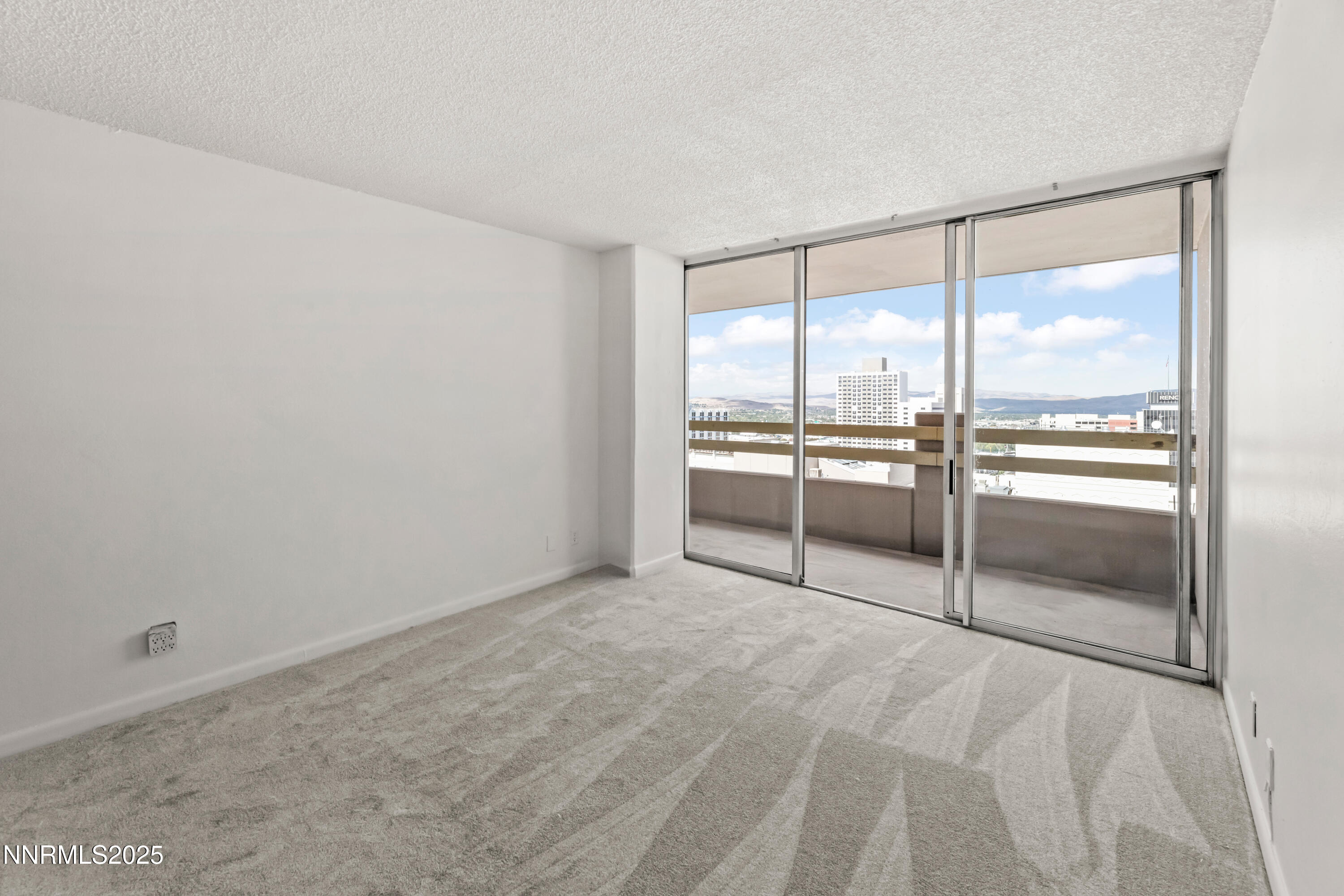 100 North Arlington Avenue, Unit 21K Reno, NV 89501 - Photo 12 of 24 a view of a kitchen with a sink and dishwasher cabinets
