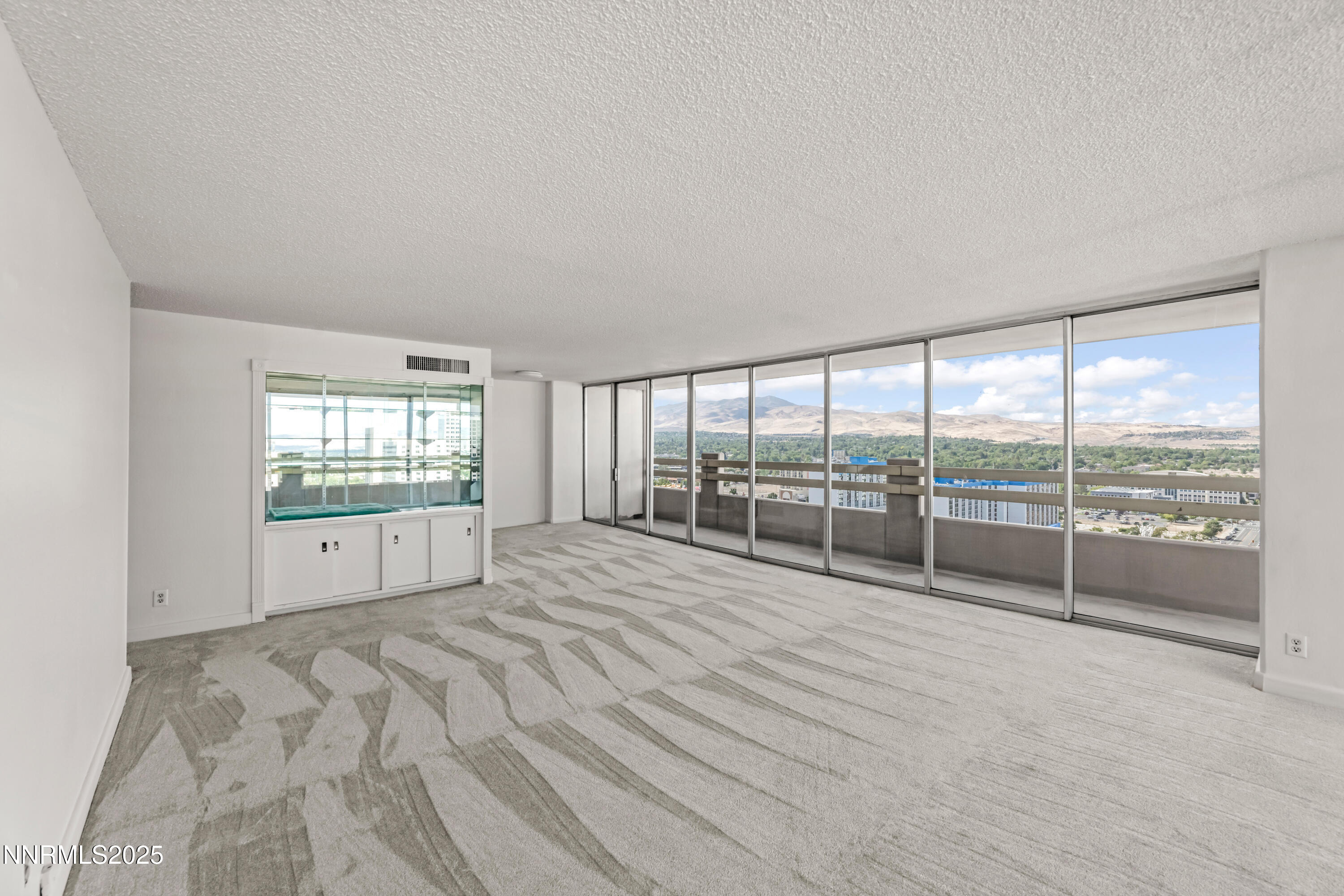 100 North Arlington Avenue, Unit 21K Reno, NV 89501 - Photo 4 of 24 a view of an empty room and window