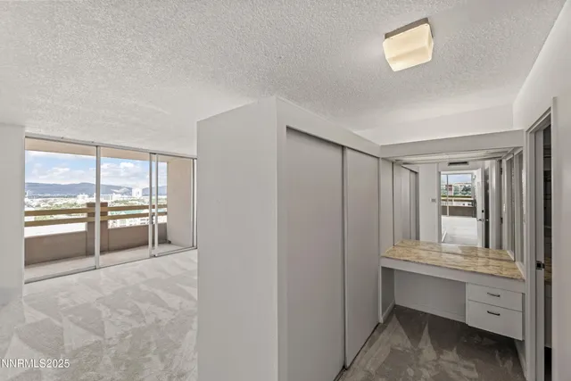 a room with window and cabinet