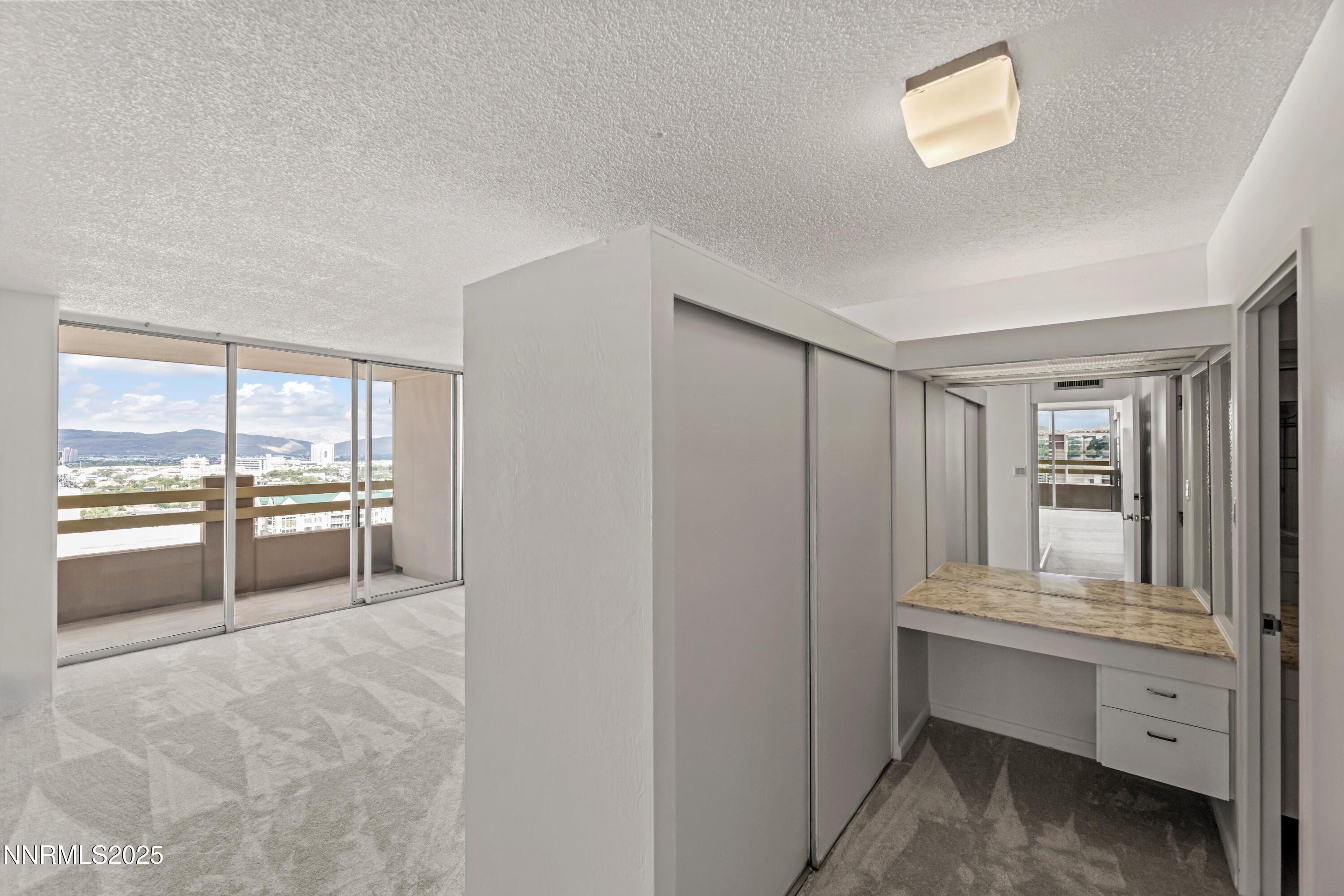 100 North Arlington Avenue, Unit 21K Reno, NV 89501 - Photo 10 of 24 a room with window and cabinet