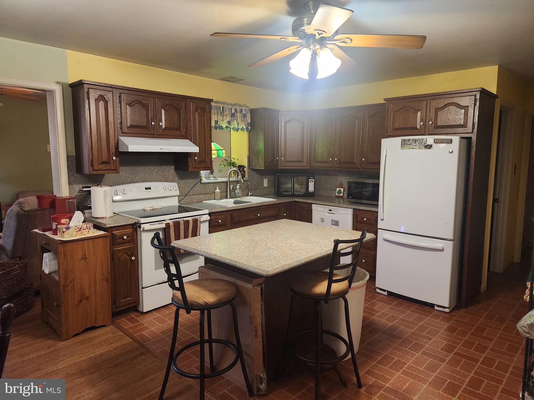 68 Daffodil Drive Manheim, PA 17545 - Photo 8 of 45 a kitchen with a table chairs refrigerator and a sink