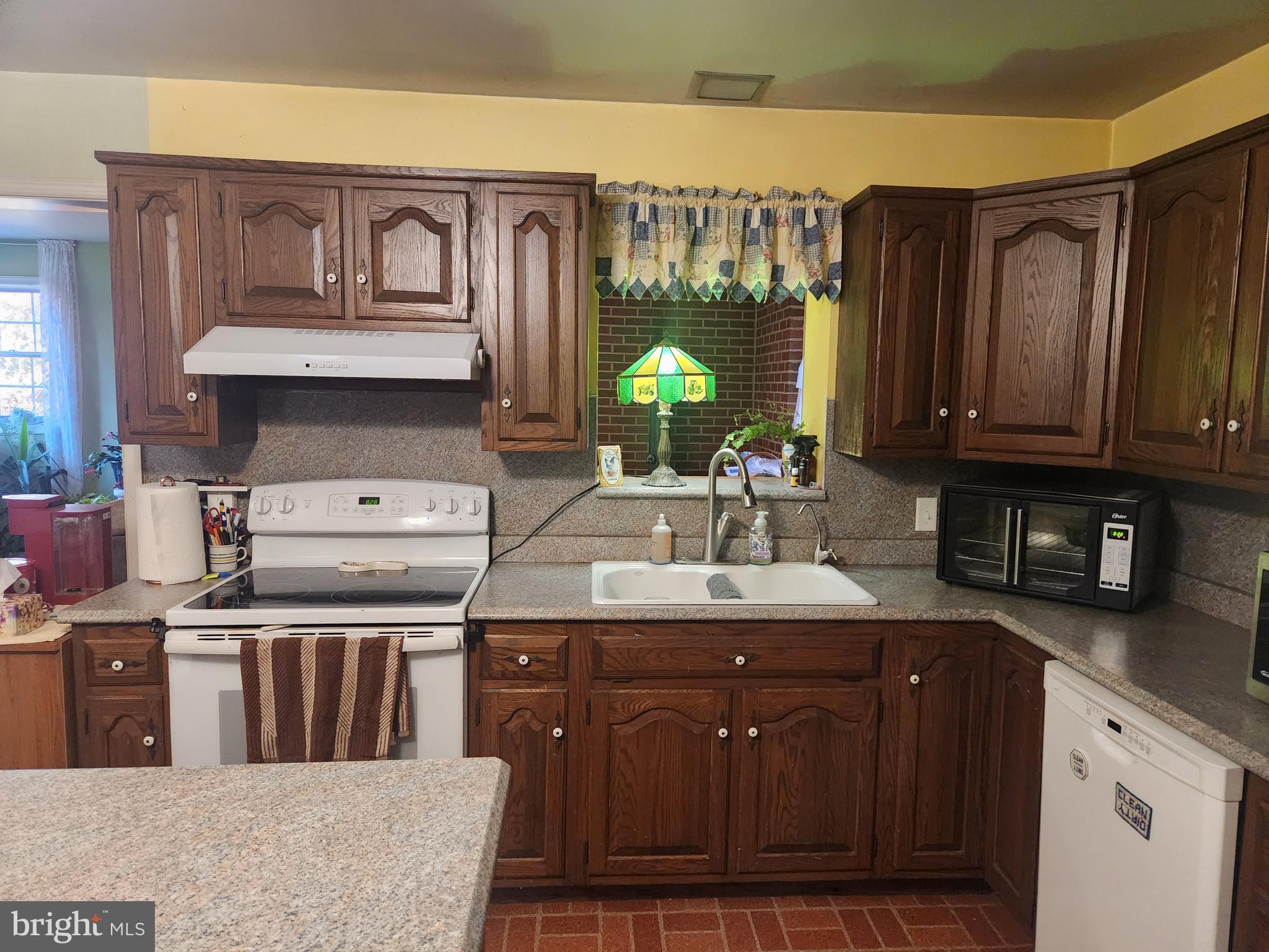 68 Daffodil Drive Manheim, PA 17545 - Photo 9 of 45 a kitchen with a sink stove and cabinets