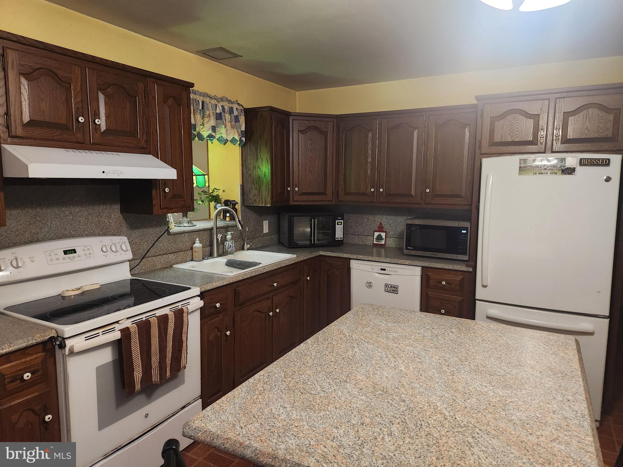 68 Daffodil Drive Manheim, PA 17545 - Photo 10 of 45 a kitchen with a stove sink and cabinets