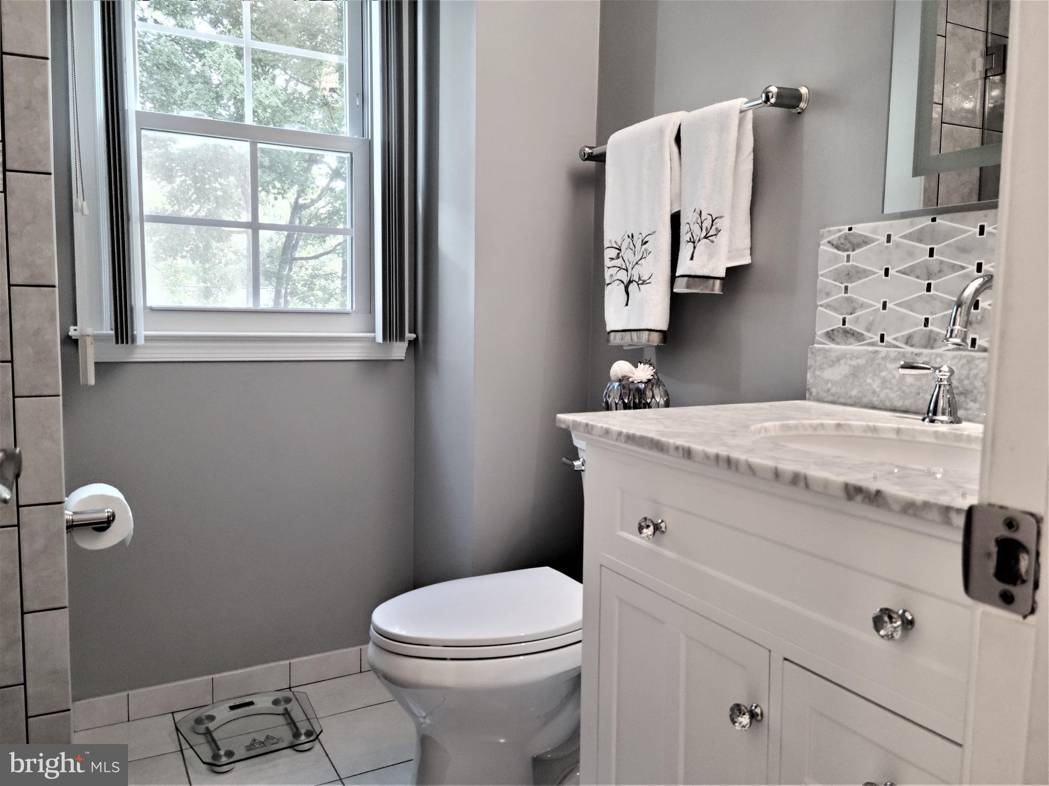 6937 Sydenstricker Road Springfield, VA 22152 - Photo 31 of 44 Hallway bathroom (upper level)