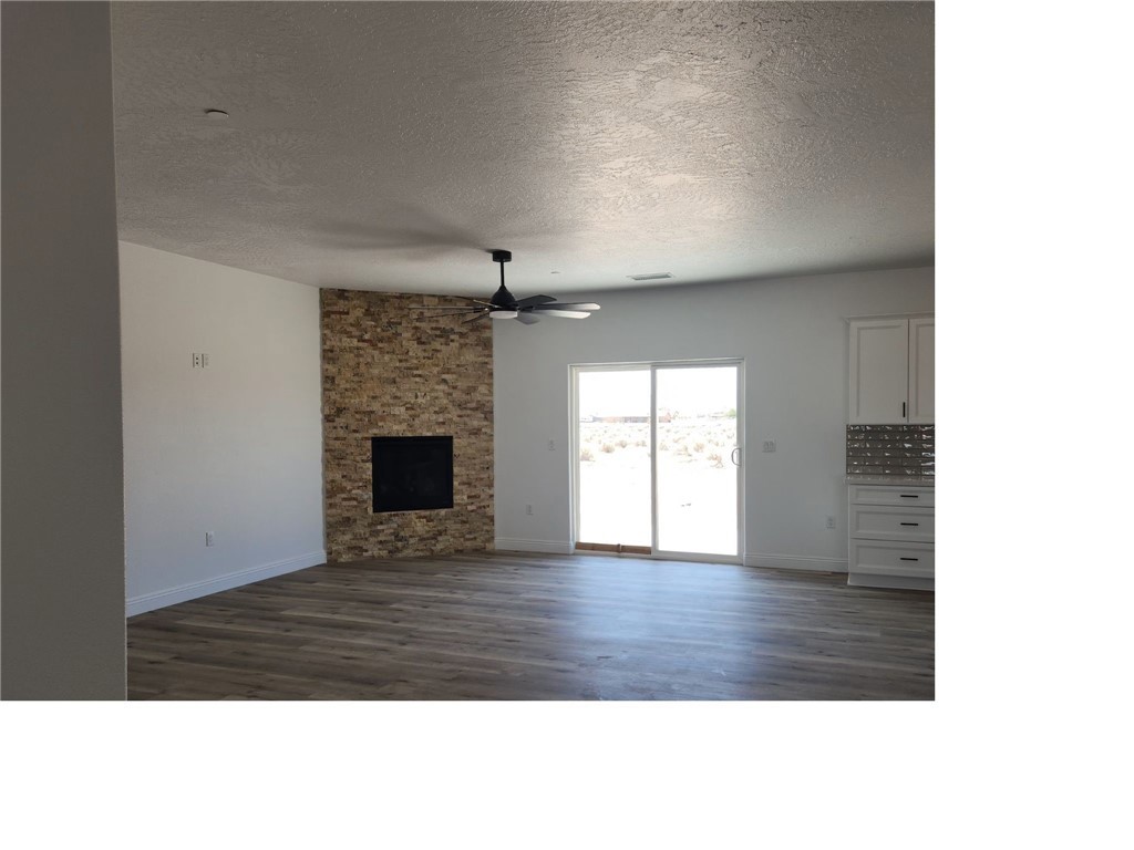 21053 Huasna Road Apple Valley, CA 92307 - Photo 2 of 19 Entry has Fireplace with stone.